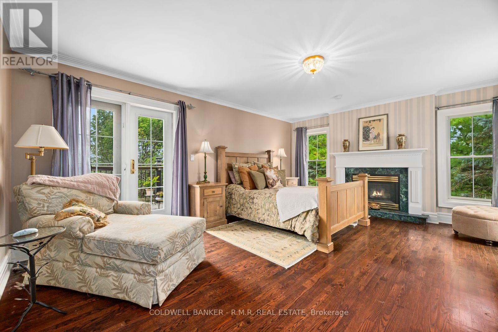 Primary Bedroom with Fireplace - 26 Mill Run Gate, Uxbridge, ON