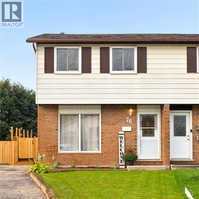 Brick and siding exterior with a brown shingled roof and brown shutters - 76 Cluthe Crescent, Kitchener, ON