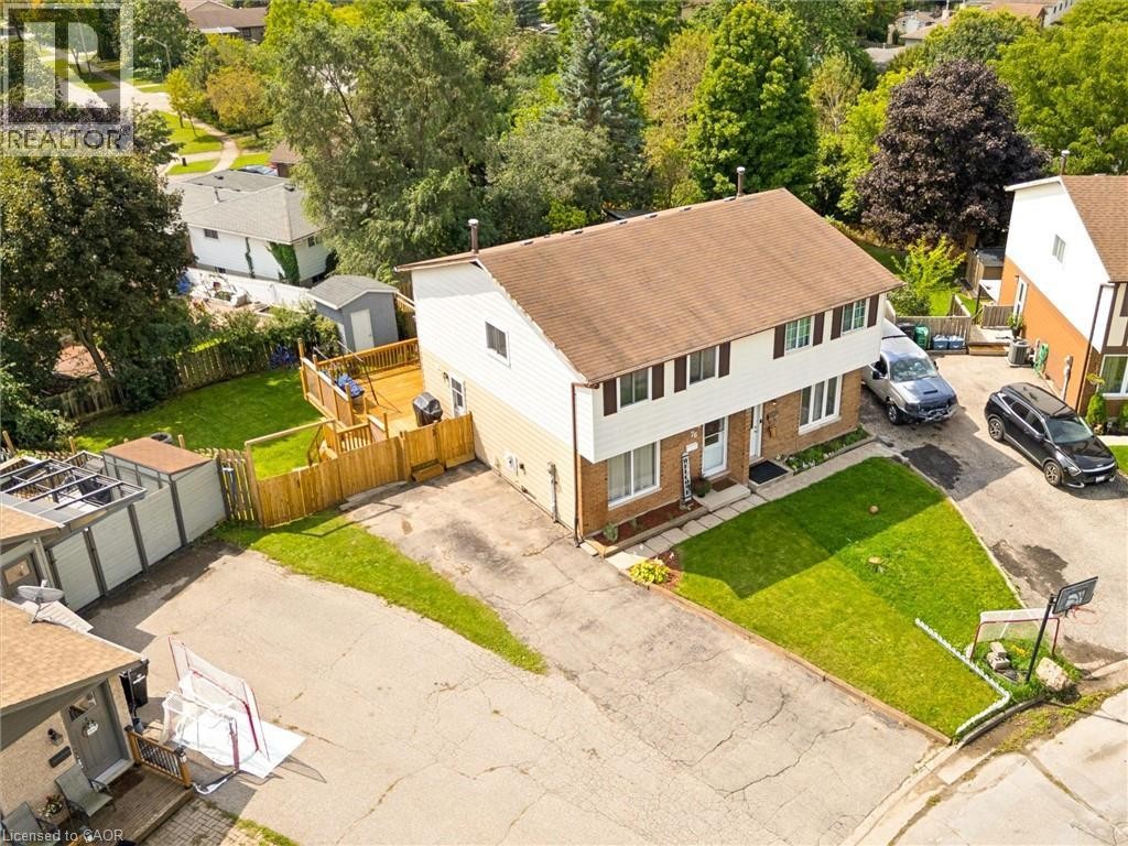Expansive rear decking featuring a privacy fence and a dedicated storage shed - 76 Cluthe Crescent, Kitchener, ON