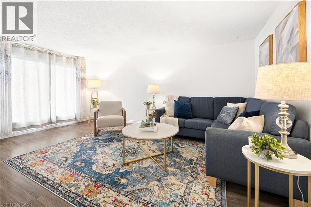 Wood-finish flooring with white wall finishes - 76 Cluthe Crescent, Kitchener, ON