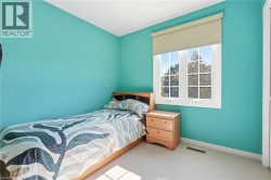 Bright room with a large grid-pattern window and soft carpet flooring -
