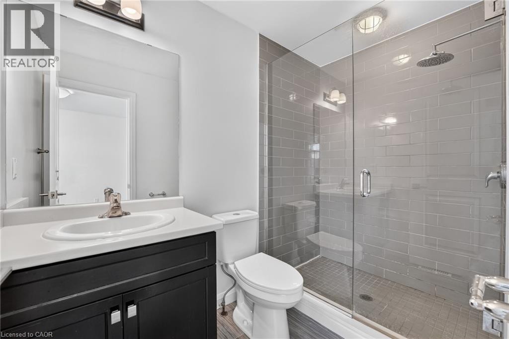 Glass-enclosed shower with subway tile surround, rain shower head, and built-in niche - 1169 E Garner Road E Unit# 66, Ancaster, ON