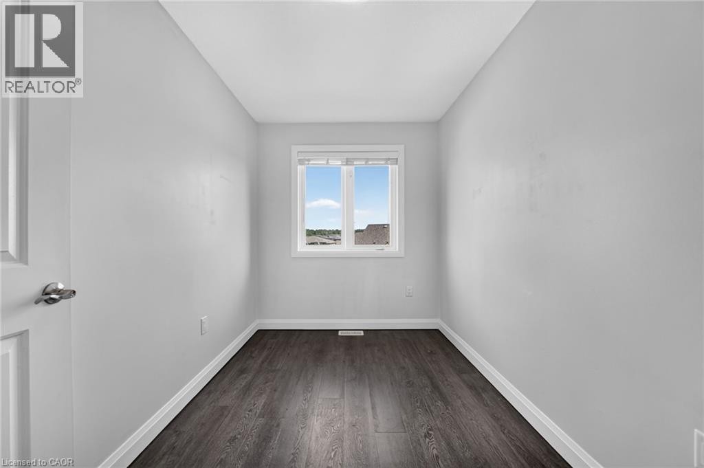 Wood-finish flooring, white walls, and a window with white trim - 1169 E Garner Road E Unit# 66, Ancaster, ON