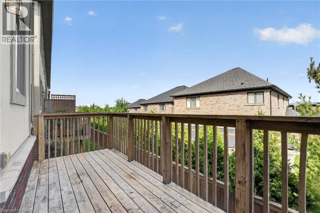 Wood deck with wood railing - 1169 E Garner Road E Unit# 66, Ancaster, ON