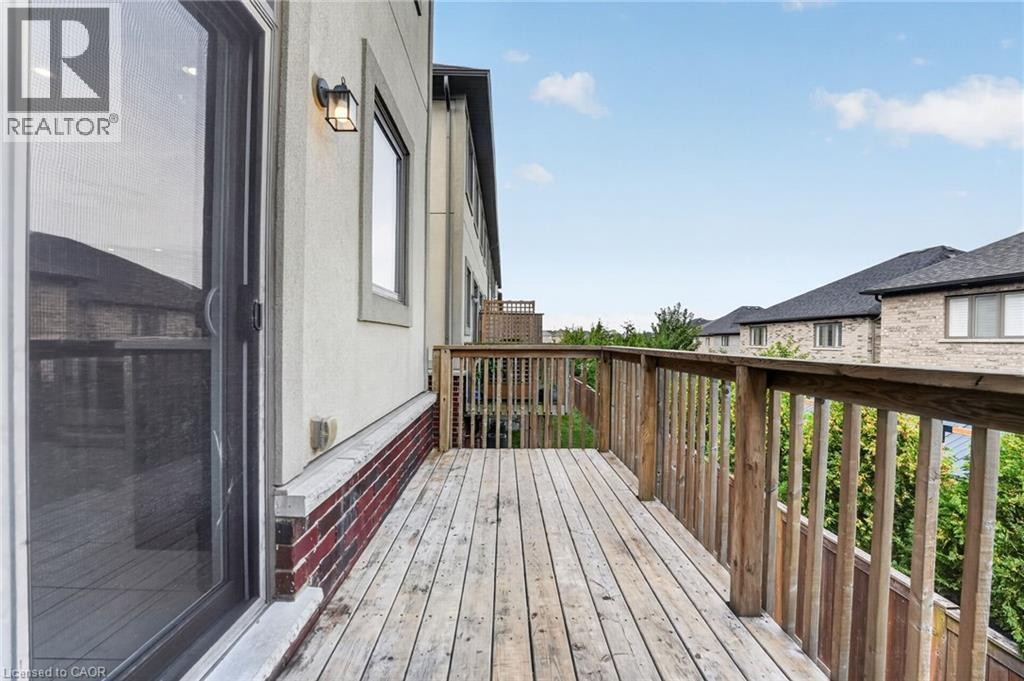 Wood-plank outdoor deck with natural wood railing - 1169 E Garner Road E Unit# 66, Ancaster, ON