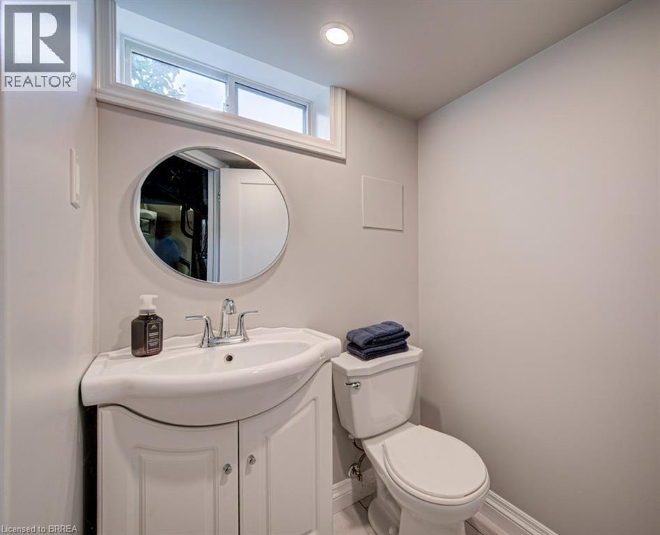 Vanity with cabinet storage, chrome faucet, and integrated sink - 3158 Palmer Drive, Burlington, ON