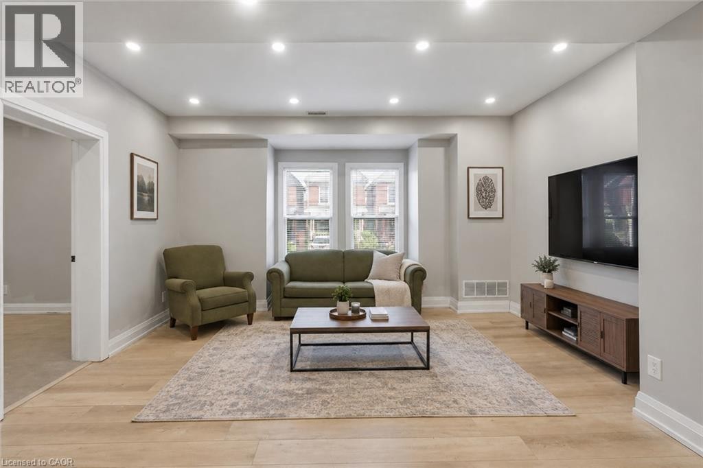 Main Floor Living Rm Virtually staged - 106 Barnesdale Avenue N, Hamilton, ON