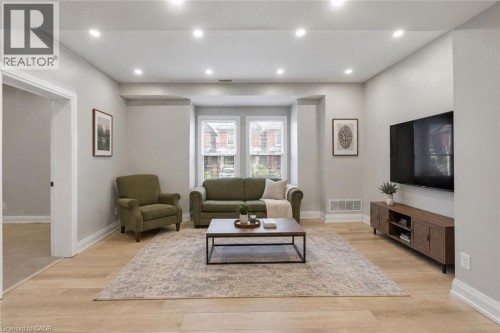 Main Floor Living Rm Virtually staged - 106 Barnesdale Avenue N, Hamilton, ON 