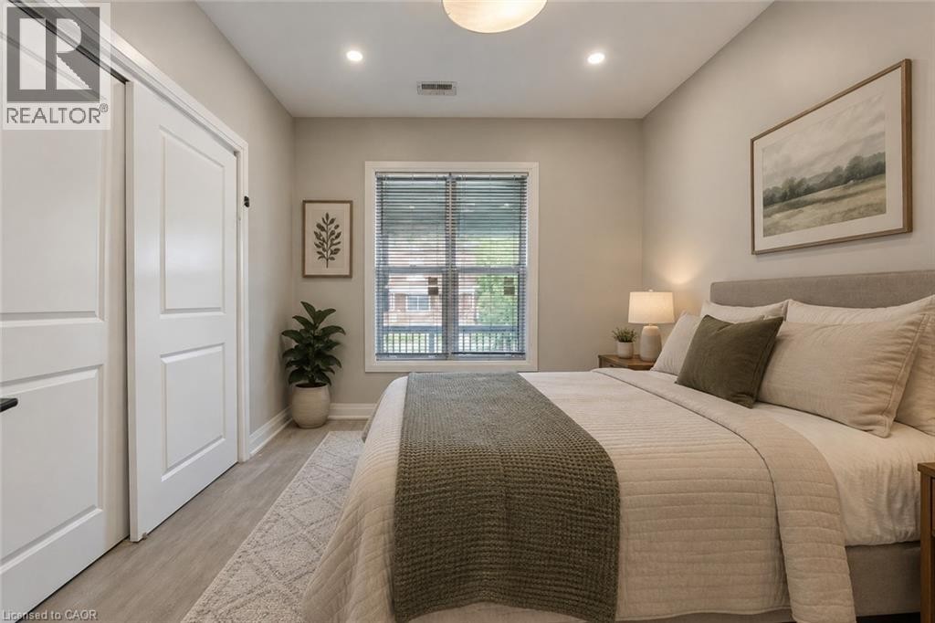 Main Floor Bedroom Virtually staged - 106 Barnesdale Avenue N, Hamilton, ON