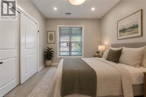 Main Floor Bedroom Virtually staged - 106 Barnesdale Avenue N, Hamilton, ON 