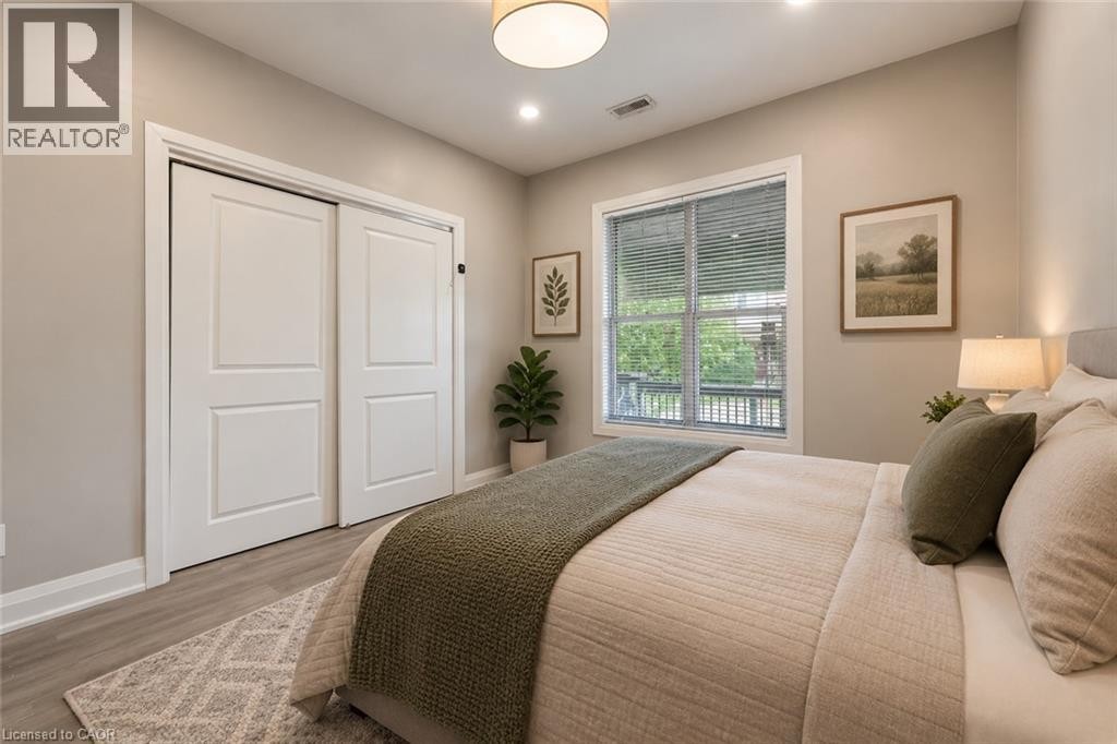 Main Floor Bedroom Virtually staged - 106 Barnesdale Avenue N, Hamilton, ON