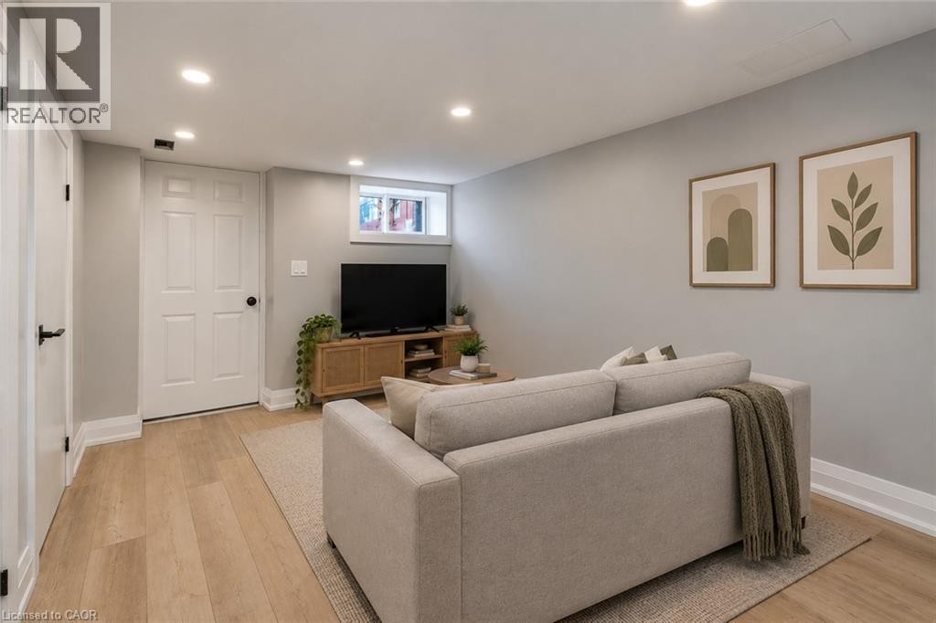 Basement Living Rm Virtually staged - 106 Barnesdale Avenue N, Hamilton, ON