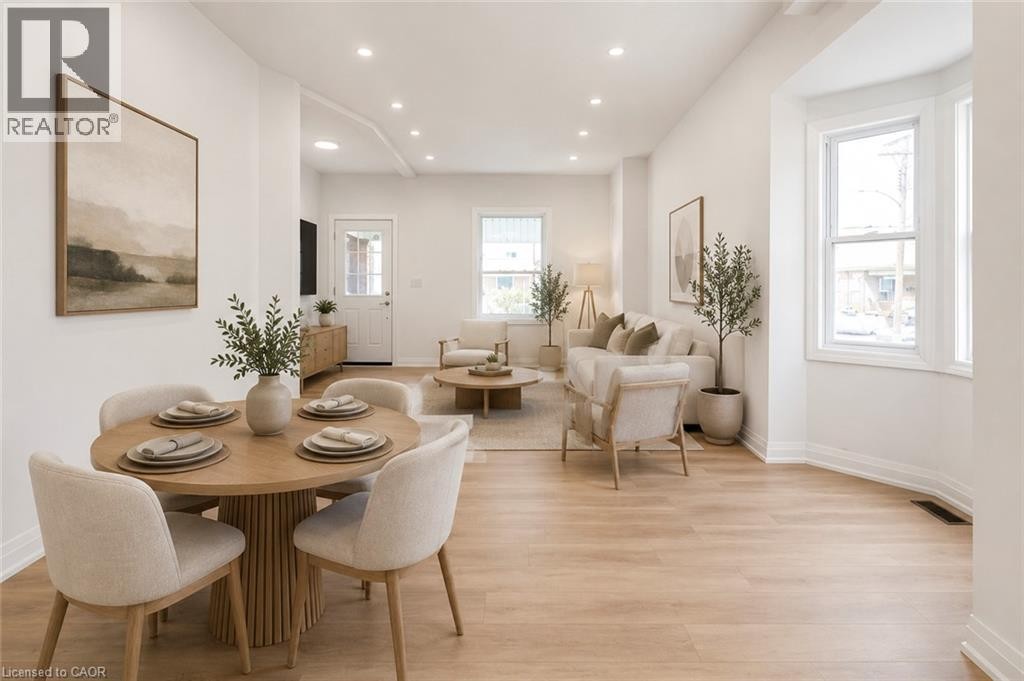 Recessed lighting throughout, wood-finish flooring, and multiple windows providing ample illumination - 90 Belview Avenue, Hamilton, ON