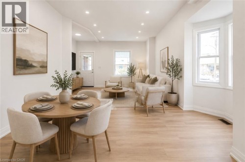 Recessed lighting throughout, wood-finish flooring, and multiple windows providing ample illumination - 90 Belview Avenue, Hamilton, ON 