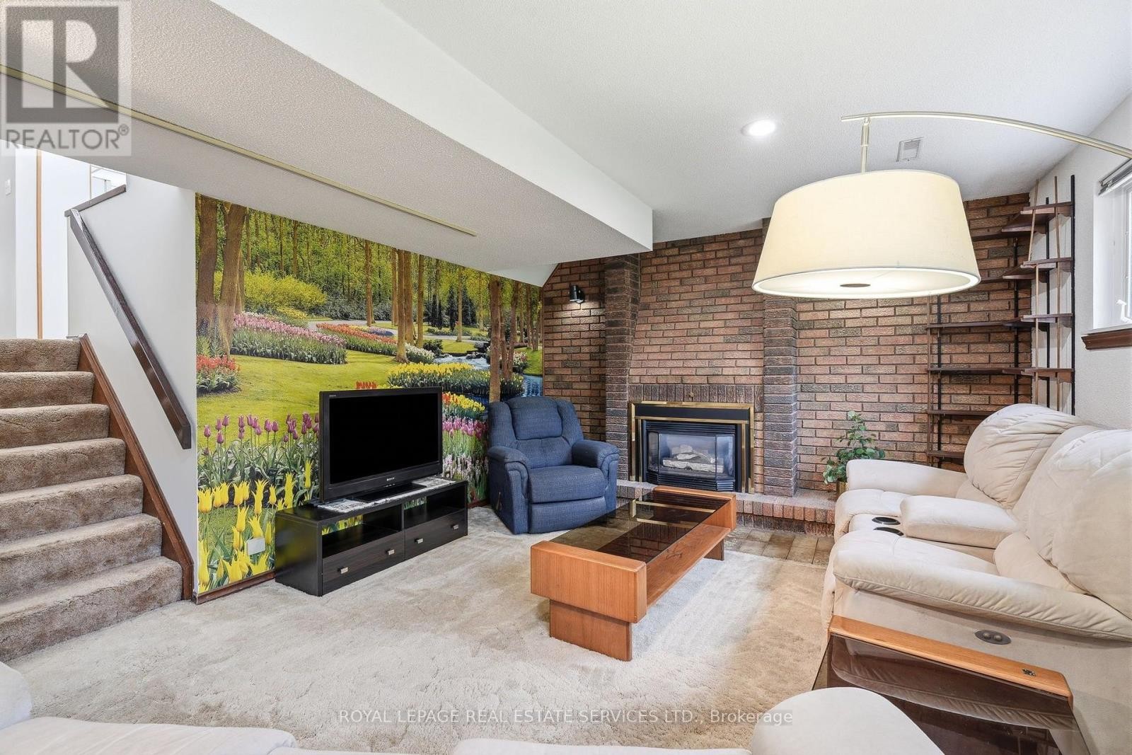 gas fireplace in family room - 60 Bowshelm Court, Mississauga, ON