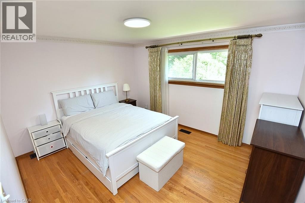 Hardwood flooring, crown molding, and a window with wood trim - 372 Fennell Avenue W, Hamilton, ON