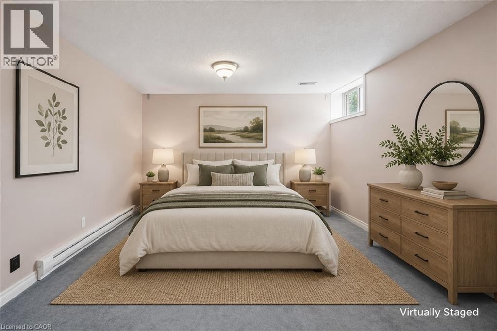 Recessed window, textured ceiling, flush mount ceiling light, wall-mounted baseboard heating, carpeted flooring - 426 Hidden Creek Drive, Kitchener, ON