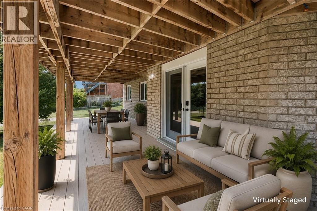 Covered outdoor patio with exposed wood beam ceiling - 426 Hidden Creek Drive, Kitchener, ON