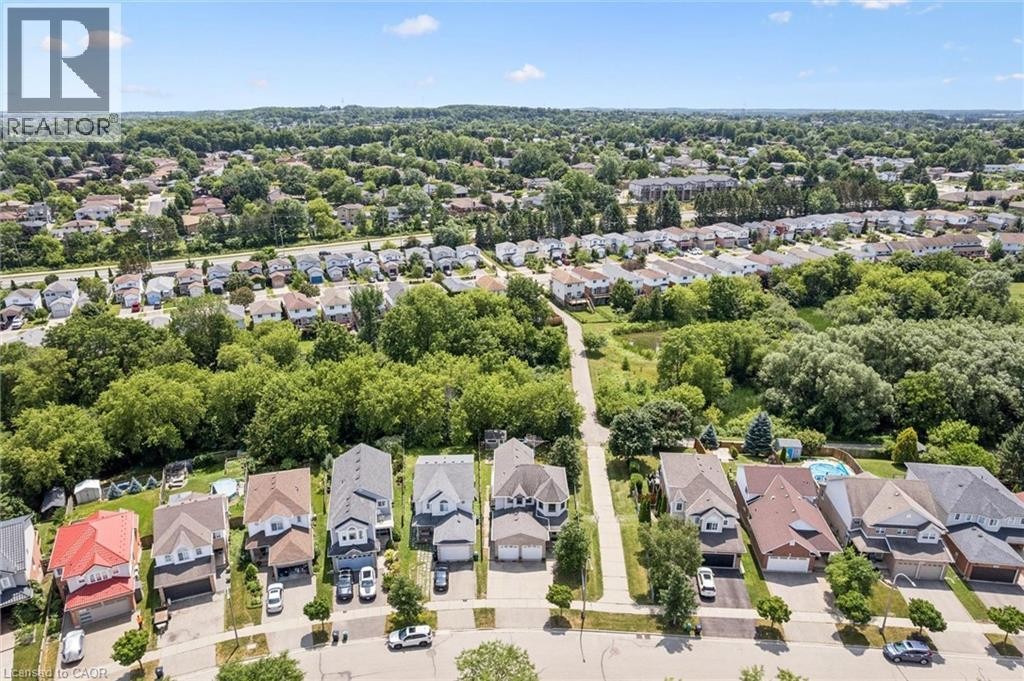 Residential neighborhood with mature trees, green spaces, and a variety of architectural styles - 426 Hidden Creek Drive, Kitchener, ON