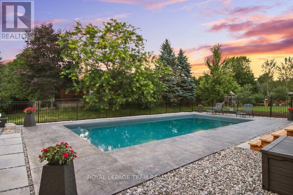 ENJOY AN OUTDOOR FIRE BESIDE YOUR HEATED POOL - 1801 Cedarlakes Way, Ottawa, ON
