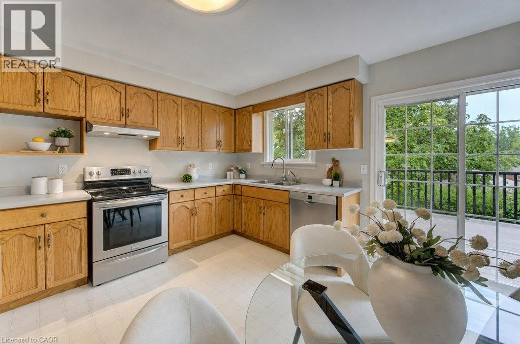 Sliding doors open to composite deck with a great view - 26 Stanmore Avenue, Kitchener, ON