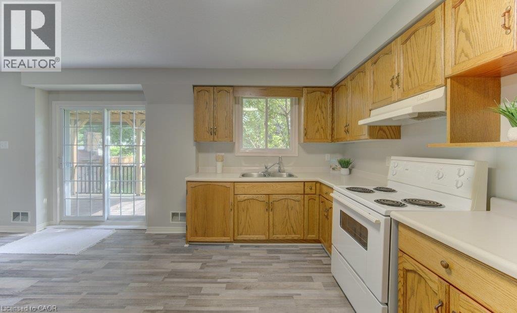Lower level (walkout basement). Sliding doors to covered composite deck. - 26 Stanmore Avenue, Kitchener, ON