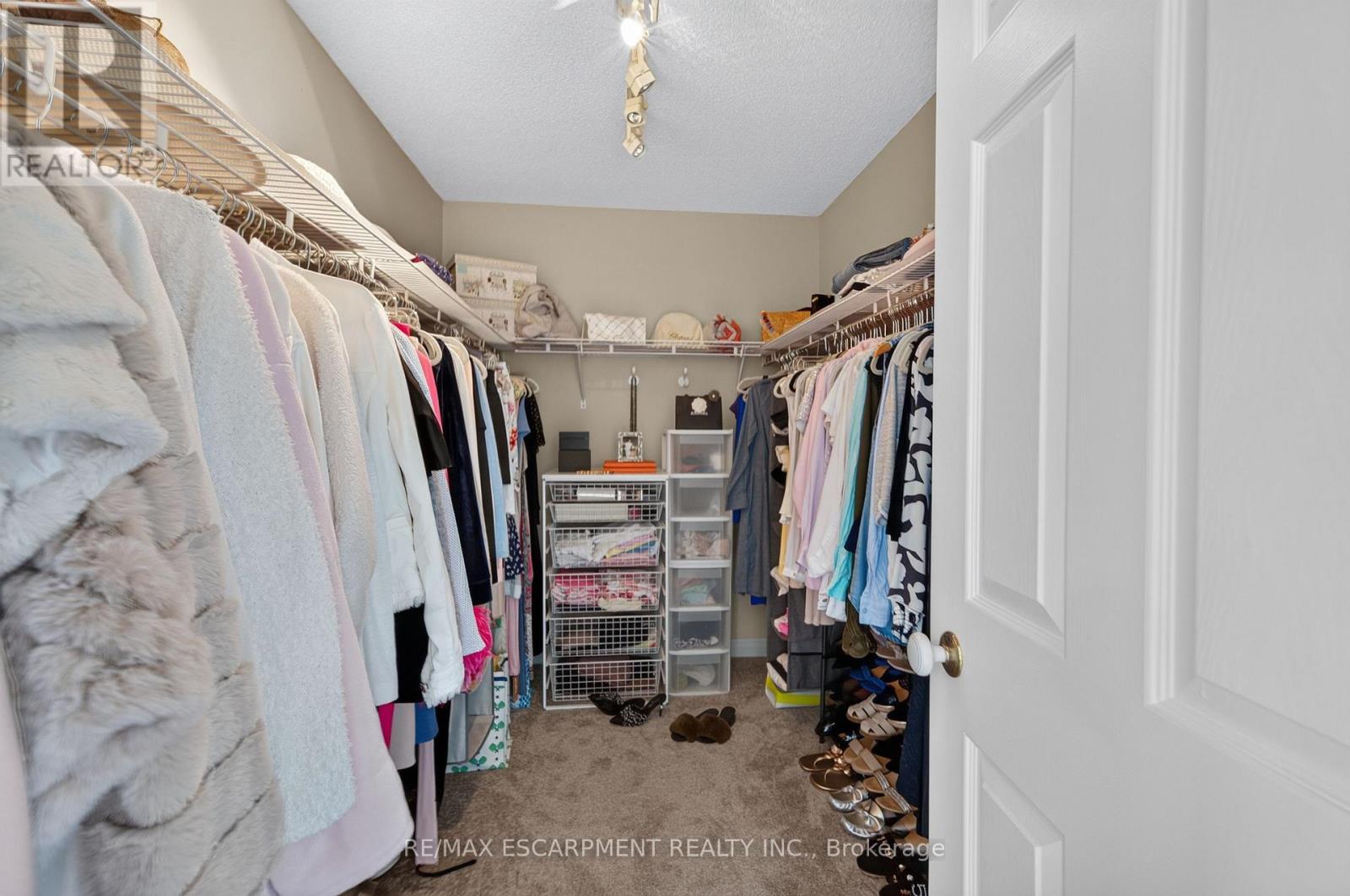 Primary walk-in closet - 112 Fairwood Place W, Burlington, ON
