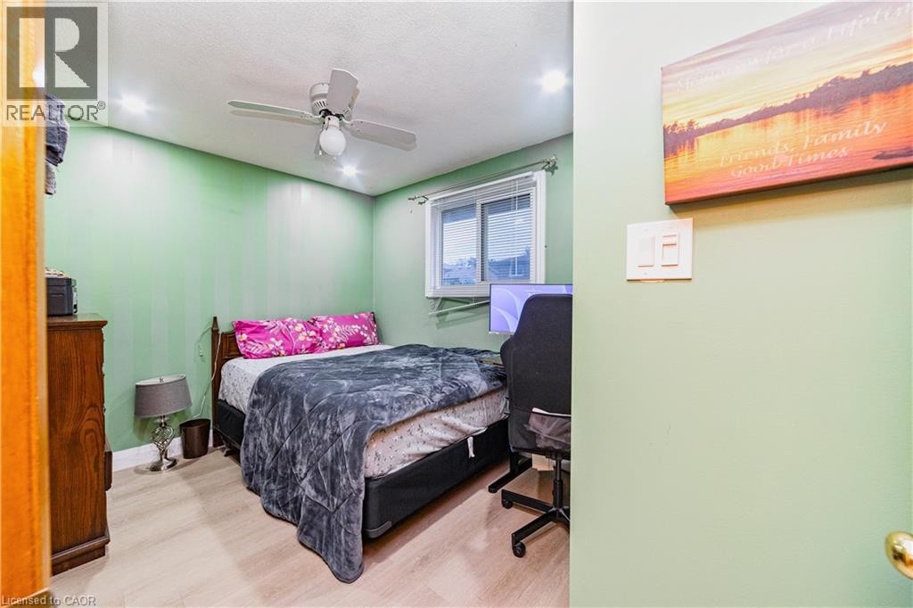 Recessed lighting, wood-finish flooring, ceiling fan, and a window for natural light - 41 Tuerr Drive, Kitchener, ON