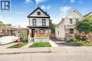 Contemporary facade with white brick and black trim - 250 Rosslyn Avenue N, Hamilton, ON 