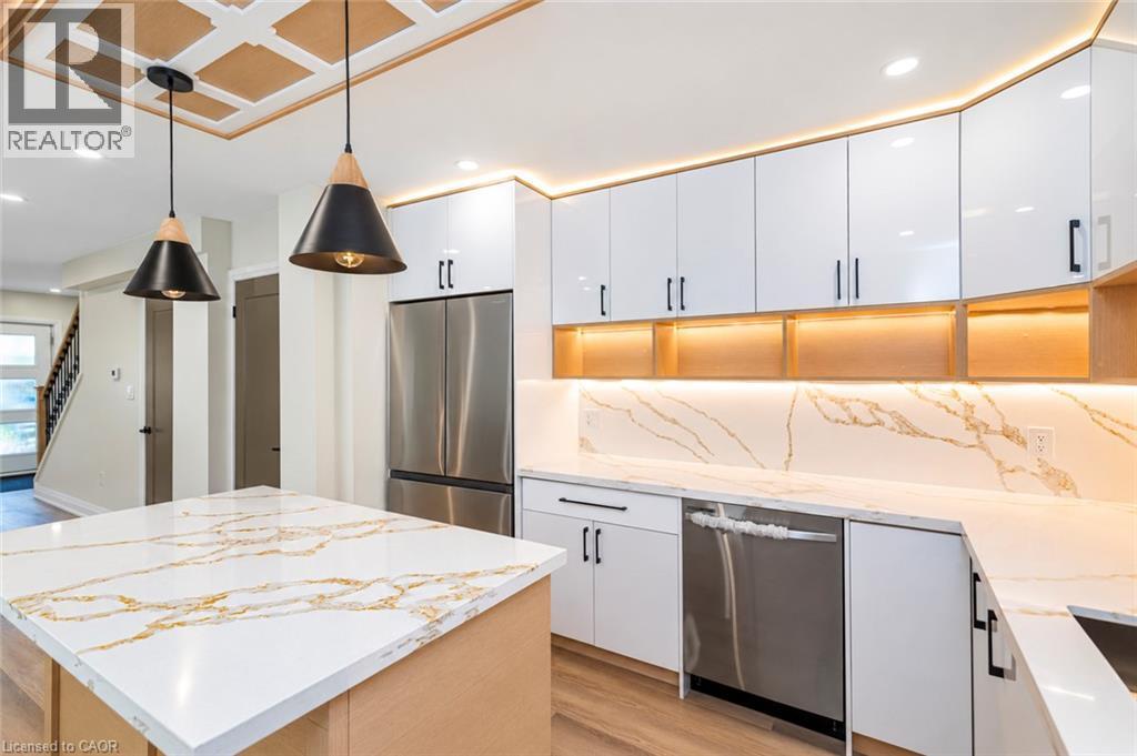 Recessed ceiling with decorative paneling and two modern pendant lights - 250 Rosslyn Avenue N, Hamilton, ON