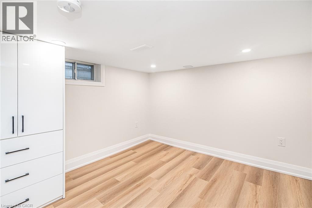 White built-in cabinetry with black hardware - 250 Rosslyn Avenue N, Hamilton, ON
