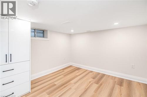 White built-in cabinetry with black hardware - 250 Rosslyn Avenue N, Hamilton, ON 