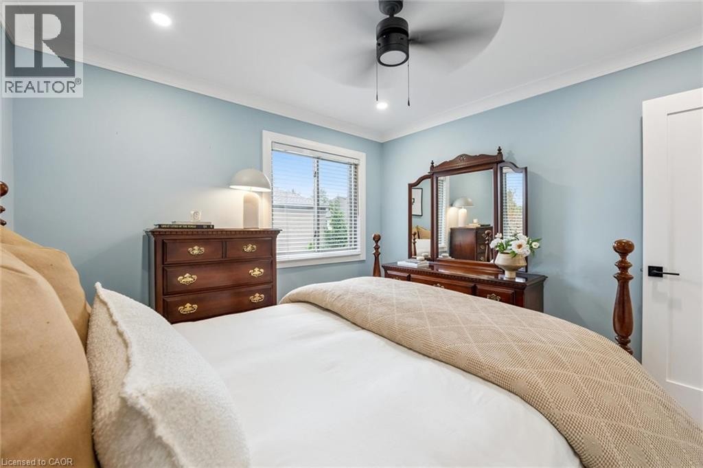 Recessed ceiling lighting, ceiling fan with light, crown molding, white trim, and a built-in window - 1261 Stephenson Drive, Burlington, ON