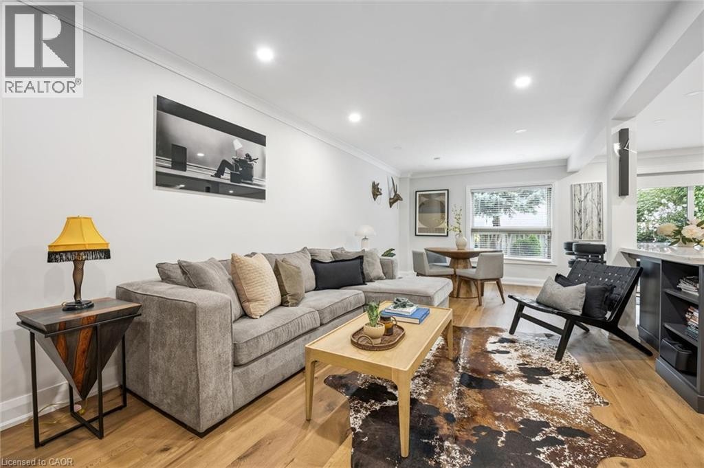 Recessed lighting, crown molding, wood-finish flooring, bay window, and built-in shelving - 1261 Stephenson Drive, Burlington, ON