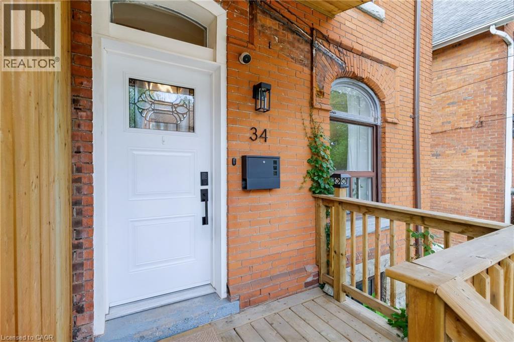 Brick exterior with an arched window - 34 Baillie Street, Hamilton, ON