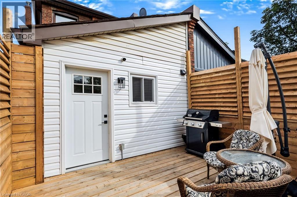 Outdoor decking with wood privacy fencing - 34 Baillie Street, Hamilton, ON