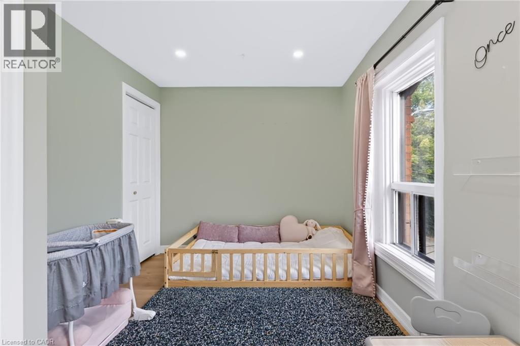 Recessed lighting, wood-finish flooring, and a single window - 34 Baillie Street, Hamilton, ON