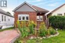Brick exterior with gray siding accents - 136 Weir Street N, Hamilton, ON 
