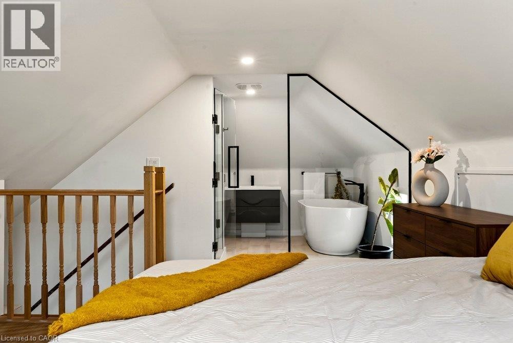 White interior walls with recessed lighting - 136 Weir Street N, Hamilton, ON
