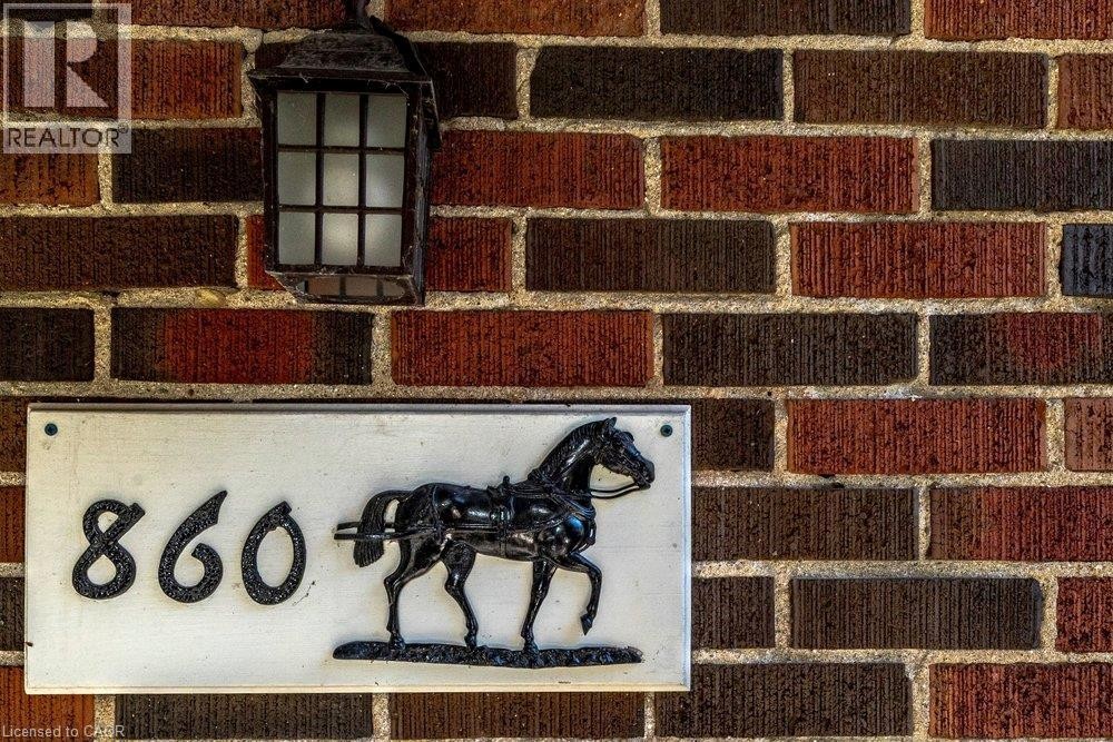 Brick exterior with a lantern-style sconce - 860 Garth Street, Hamilton, ON