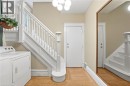 front foyer shared laundry - 63 Melrose Avenue S, Hamilton, ON 
