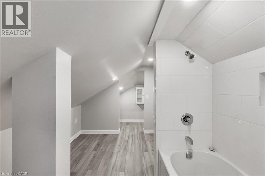 Sloped ceilings with recessed lighting - 229 Parkdale Avenue N, Hamilton, ON