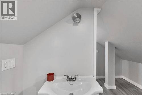 Pedestal sink with chrome-finish faucet - 229 Parkdale Avenue N, Hamilton, ON 