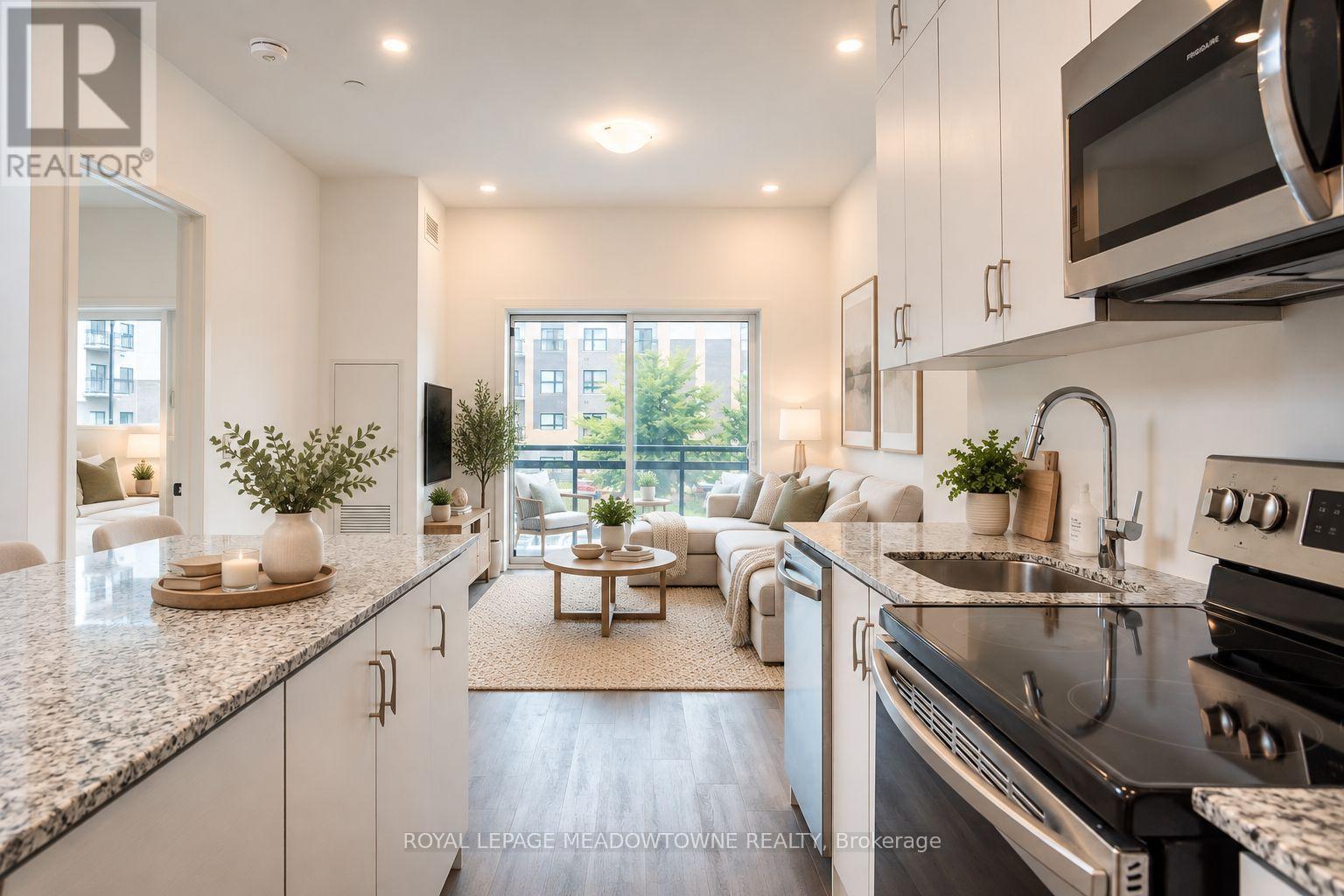 Open concept & bright kitchen and living space - 205 - 102 Grovewood Common, Oakville, ON