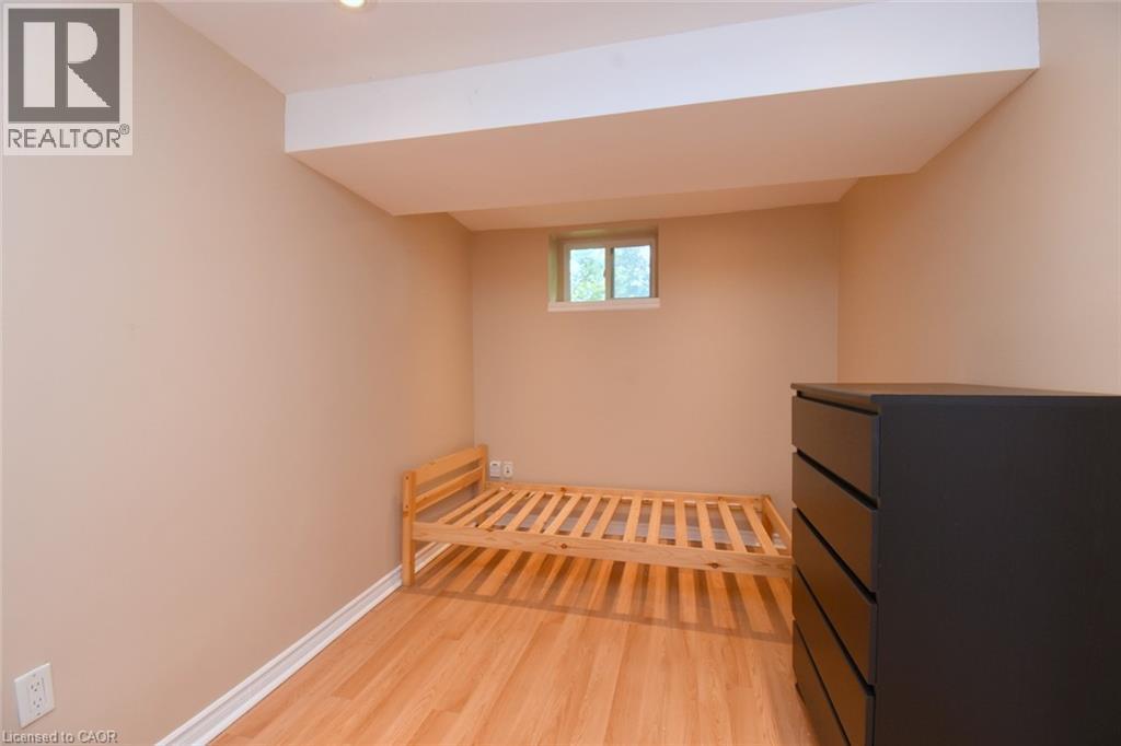 Recessed lighting, wood-finish flooring, and neutral wall tones - 734 King Street W, Hamilton, ON