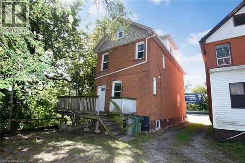 Brick exterior with multiple windows - 734 King Street W, Hamilton, ON 