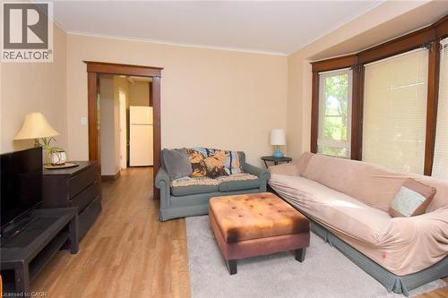 Warm neutral wall color with wood-finish flooring - 734 King Street W, Hamilton, ON 