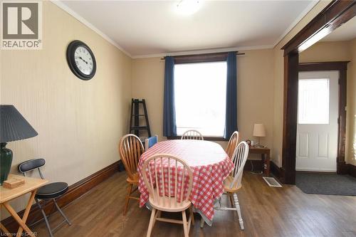 Wood-finish flooring, white ceiling, and a prominent window - 734 King Street W, Hamilton, ON 