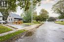 Two-story residence with light gray siding and a dark shingle roof - 102 Stewart Avenue, Cambridge, ON 