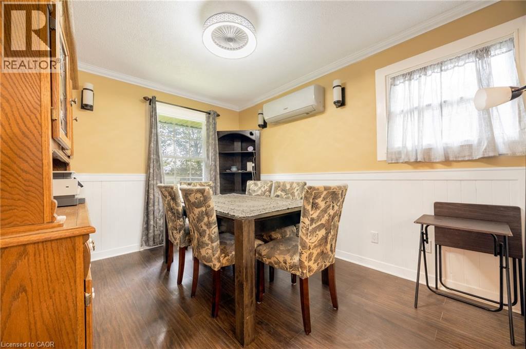 Wood-finish flooring with wainscoting and crown molding - 102 Stewart Avenue, Cambridge, ON